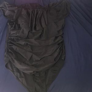 A cute off the shoulder all black ruffle one piece